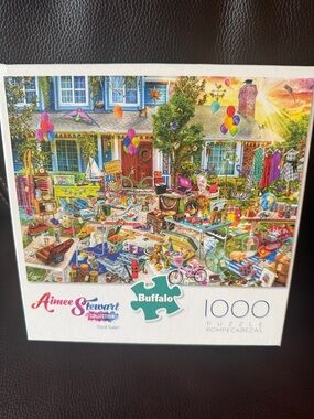Buffalo  Aimee Stewart Yard Sale 1000-Piece Puzzle. Has poster